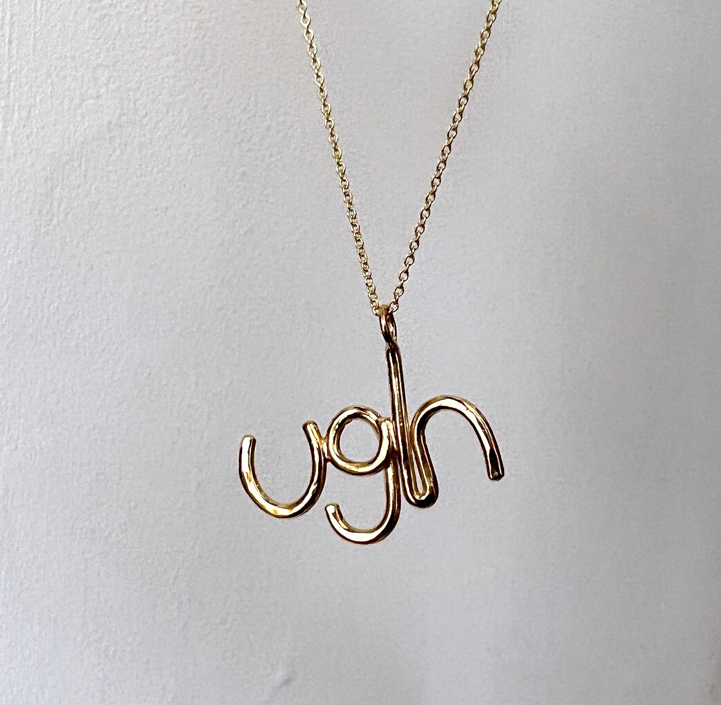 Gold Ugh Pendant