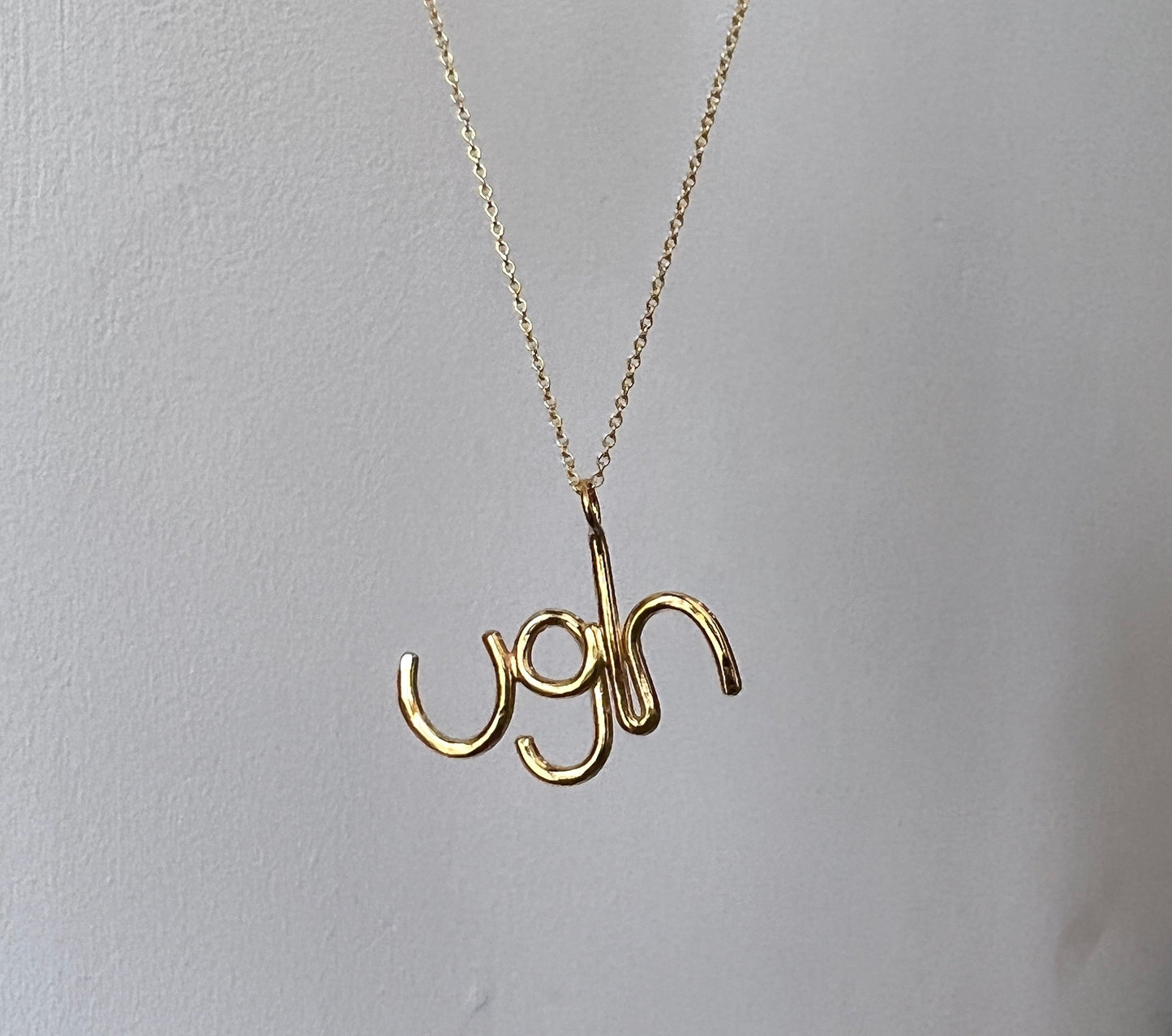 Gold Ugh Pendant