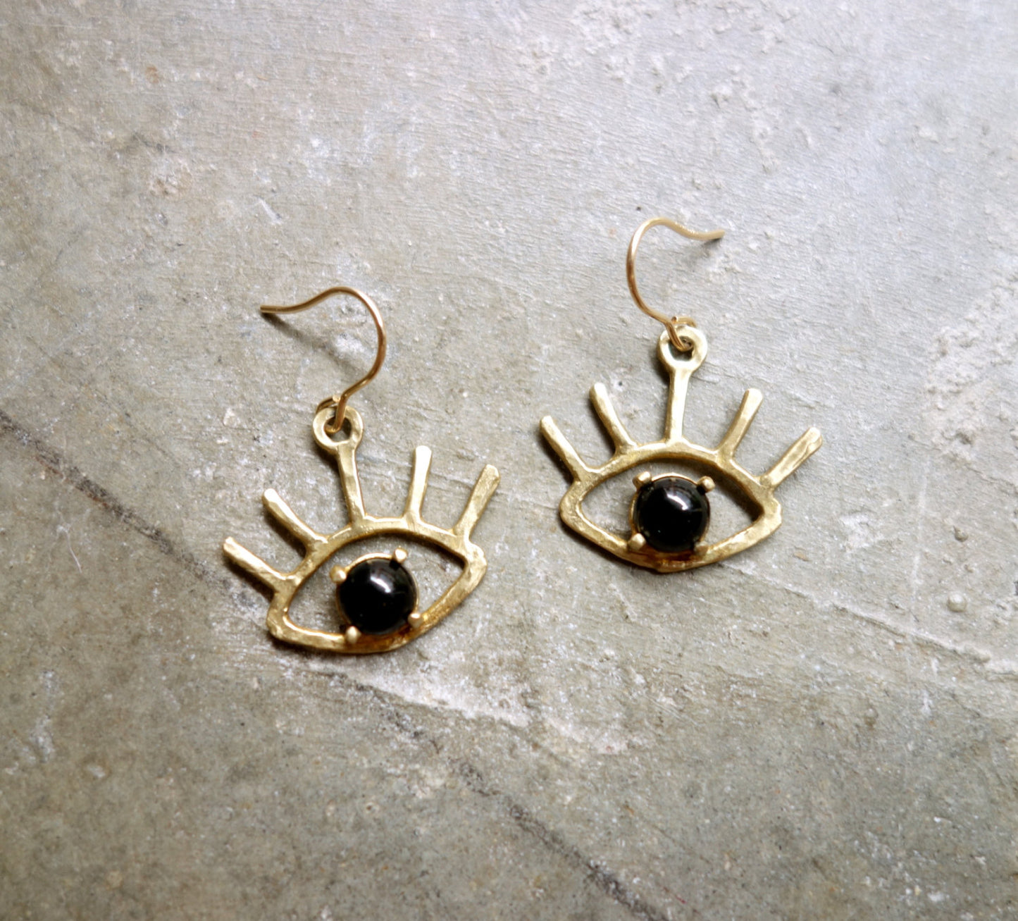 Beholder Earrings: Brass and Black Onyx Eye Dangle Earrings