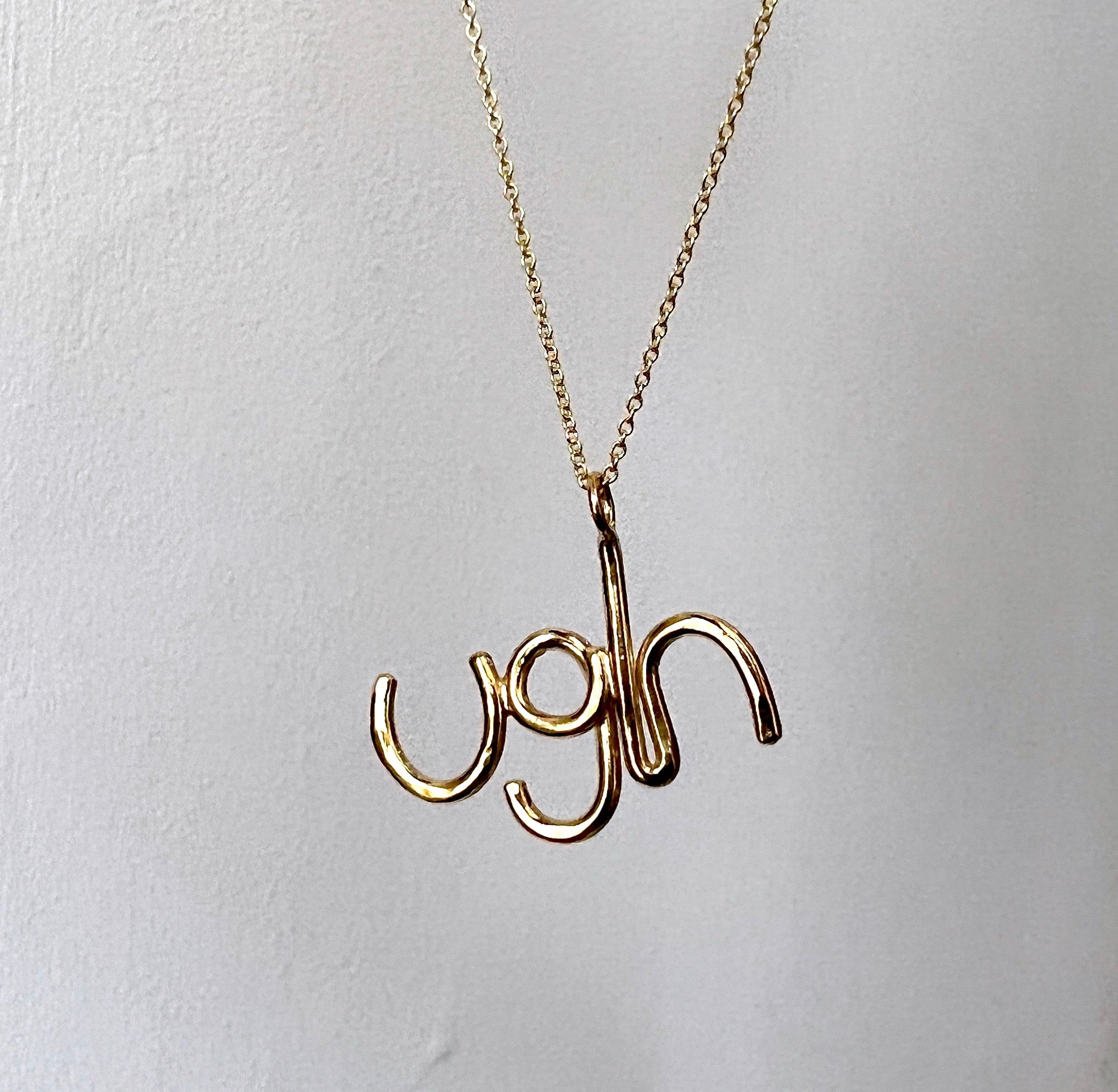 Gold Ugh Pendant