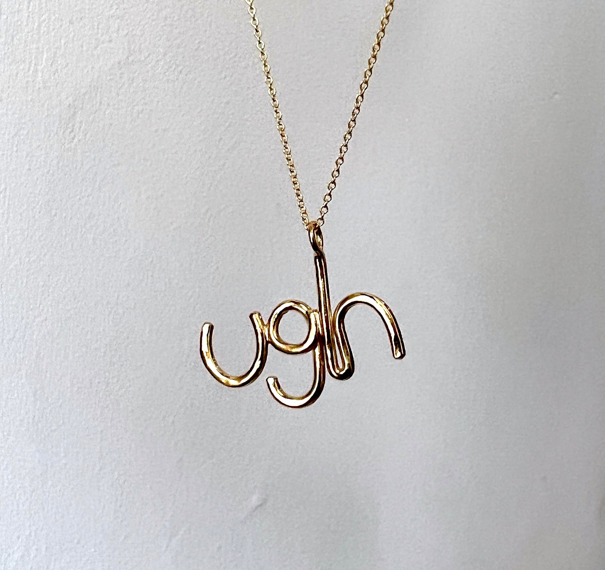 Gold Ugh Pendant