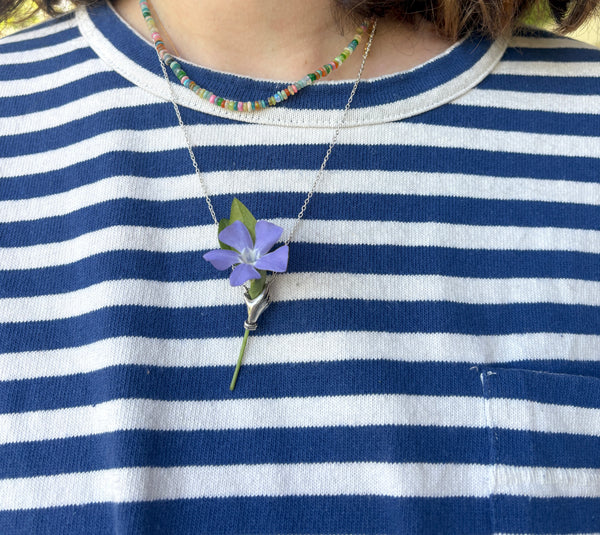 Hand Holding flowers Pendant