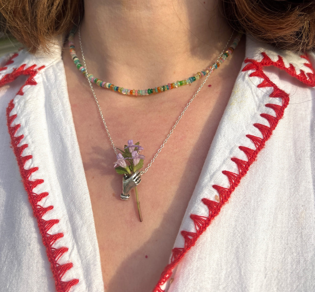 Hand Holding flowers Pendant
