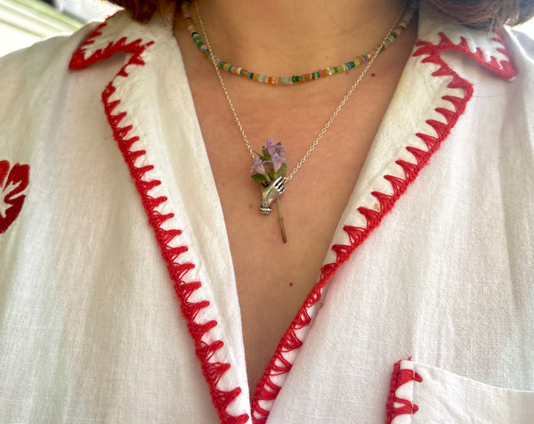 Hand Holding flowers Pendant