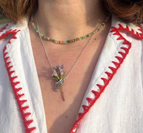Hand Holding flowers Pendant